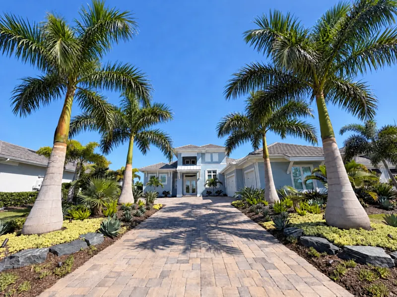 Royal palm entry: royal palms and planting beds